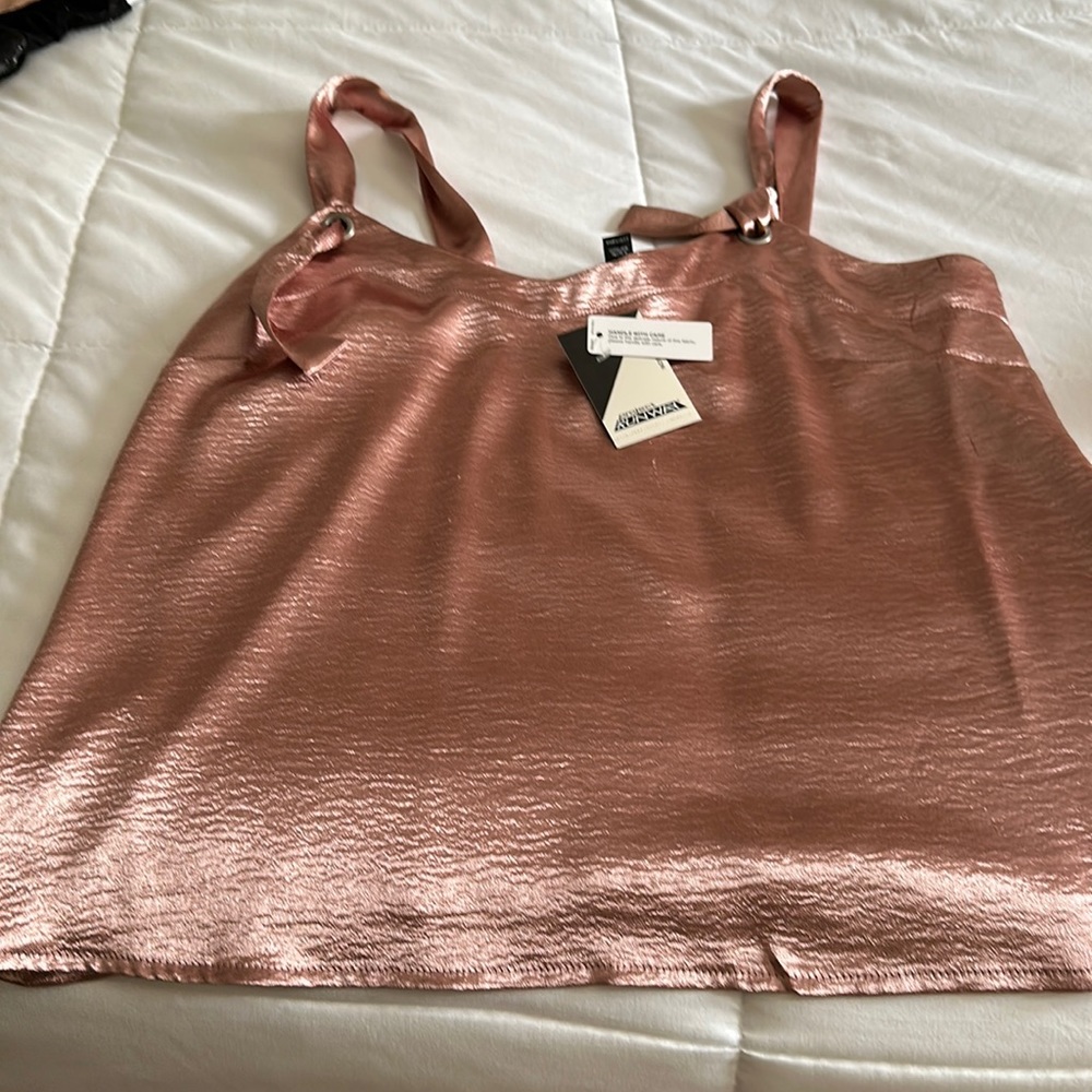 Project runway pink shirt.